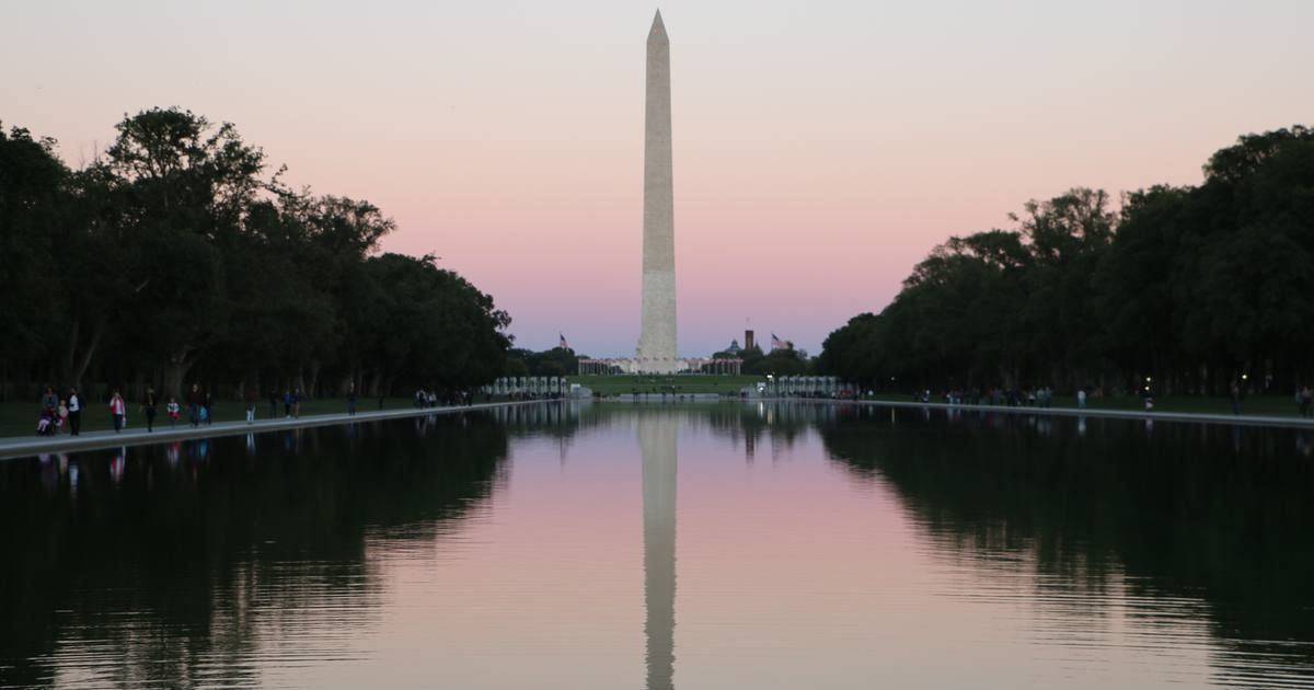The Washington Monument at dusk over the Reflecting Pool