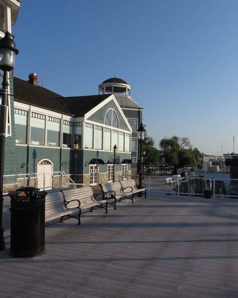 The Old Town Alexandria waterfront on the Potomac with benches and the pier