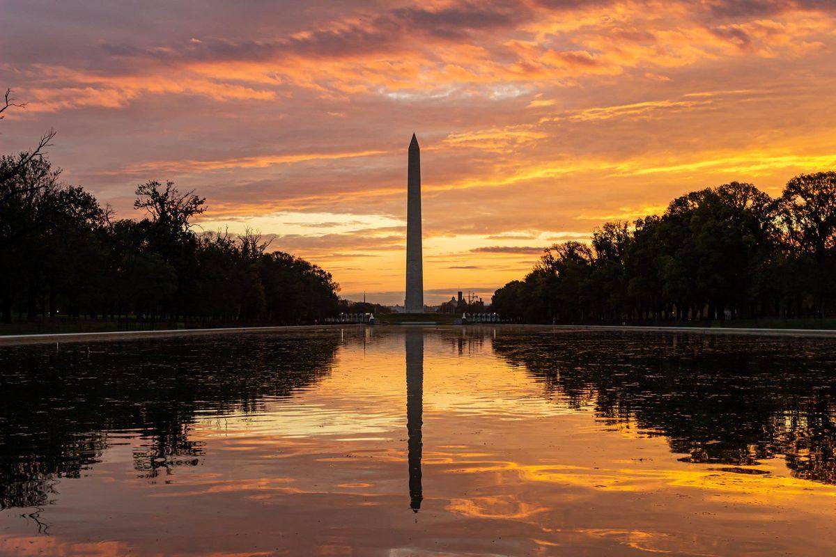The Washington Monument at sunset over the Reflecting Pool